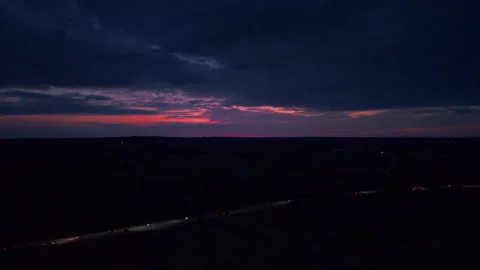 Aerial drone view of a dramatic dark sunset over a rural landscape. Deep storm Stock Footage 341785187
