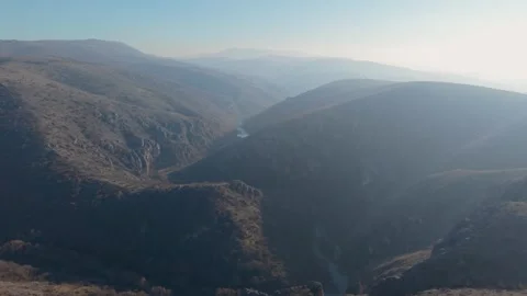 Aerial Drone View of Dramatic Mountain Canyon and River Valley in Morning Light Stock Footage 336286266