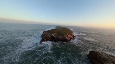 Aerial drone view of dramatic ocean cliffs at golden hour Video stock 346074671