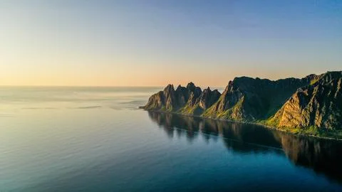 Aerial drone view of dramatic Senja Okshornan jagged coastline Stock Photos