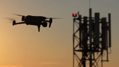 Aerial drone view of Drone flying near a cell tower for industrial inspection 스톡 동영상 345502614