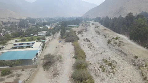 Aerial drone view of a dry river in the district of Cieneguilla Stock Footage 141836740