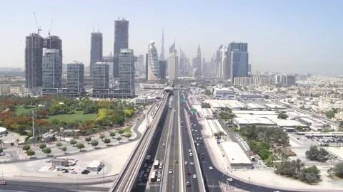 Aerial Drone view of Dubai Road, Tunnel Bridges and Metro with Dubai skyline Stock Footage