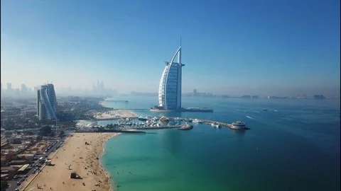 Aerial drone view of Dubai skyline with Burj Al Arab in the background Stock Footage