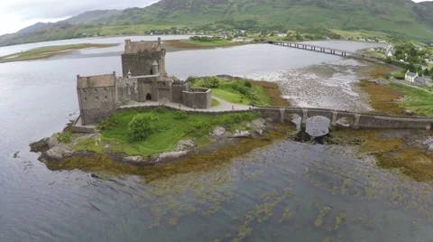 Aerial drone view of the Eileen Donan Castle in Scotland Stock Footage 64954138