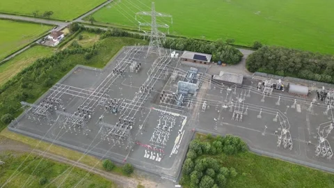 Aerial drone view of electrical substation and high-voltage transmission pylons Stock Footage 337880405