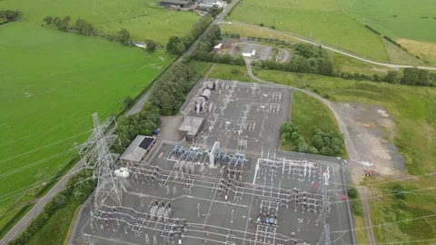 Aerial drone view of electrical substation and high-voltage transmission pylons Stock Footage 337880465