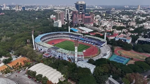 Aerial drone view of the empty M. Chinnaswamy Stadium amidst Bengalurus cit.. Stock-Footage 330274595
