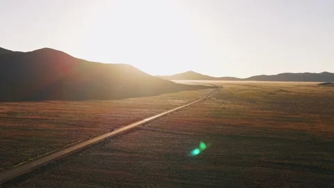 Aerial drone view of empty road in desert landscape at sunrise, Salta, Argentina Stock Footage 332172693