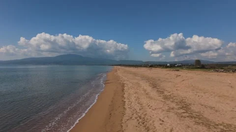 Aerial Drone View of Empty Sandy Beach With Calm Sea and Mountain Coast Stock-Footage 330960551