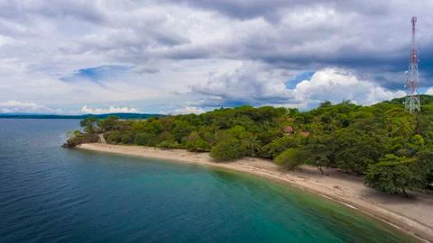 Aerial drone view of an empty white sandy beach in tropical Sumbawa, Indonesia Stockfoto's