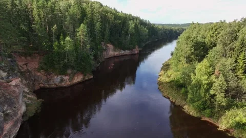 Aerial Drone View of Ērgļu Cliffs and Gauja River with Kayakers in Latvia Stock Footage 345781716