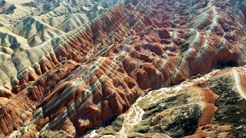 Aerial drone view of eroded sandstone ridges in Zhangye Danxia National Geopark, Video stock 330768893