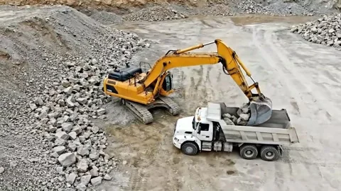 Aerial Drone View of Excavator Loading Rocks into Dump Truck. Stock Footage 317801342