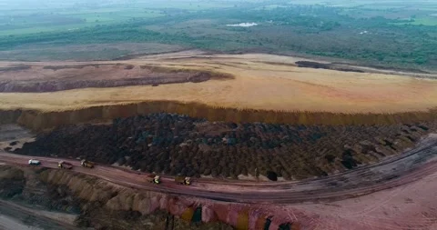 Aerial Drone View of Excavator Loading Coal with Transportation in India Stock Footage 340950731