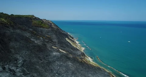 Aerial drone view of extinguished fire on hills by the sea 스톡 동영상 128294664