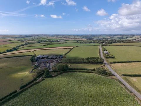 Aerial drone view of a farm complex in the rolling countryside of Looe Фото