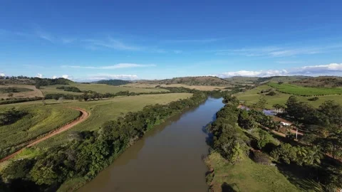 Aerial Drone View of Farm Located Along a Wide River Stock Footage 340409690