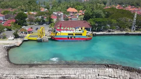 Aerial drone view of ferry unloading transport on gangway. Ferry transports cars Видео 219322976