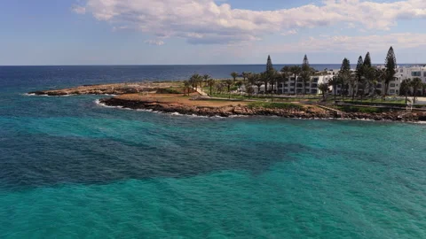 Aerial drone view of Fig Tree beach and landscaped promenade along the coast of Stock Footage 331797268
