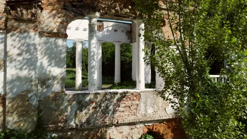 Aerial drone view flight into arch between columns of old ruins in park Stock Footage 161192401