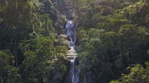 Aerial Drone View: Flight over jungle forest with Kuang Si Falls in Laos. 스톡 동영상 102265389