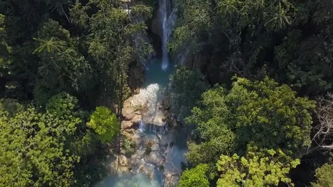Aerial Drone View: Flight over jungle forest with Kuang Si Falls in Laos. Stock Footage 102265400