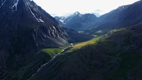 Aerial Drone View: Flight over pine tree forest and mountain river in sunset Stock Footage 119898239