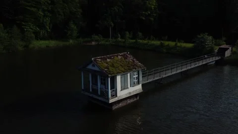 Aerial Drone View Floating Boathouse on Lake Green Roof Switzerland 4K Stock Footage 242718855