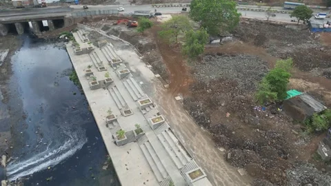 Aerial drone view of floating plastic garbage polluting city river. Stock Footage 337445654