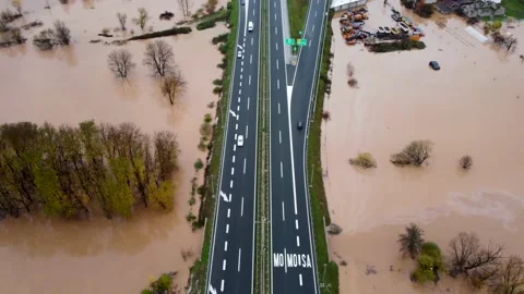Aerial drone view of flooded fields. Floodwaters near highway. Catastrophic Stock Footage 171395135