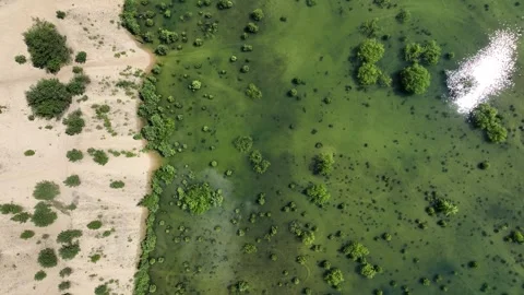 Aerial drone view of flooded sand pit. An artificial lake after a flooded s.. Stock Footage 310161663