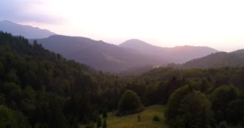 Aerial Drone View. Fly over autumn mountain  forest in sunrise soft light. 動画素材 150680134