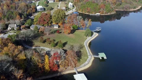Aerial drone view fly over of luxury large lake front homes Stock Footage 220660369