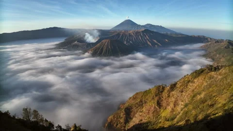 Aerial drone view fly pass hill to reveal Bromo volcano, Java, Indonesia Video stock 255387211