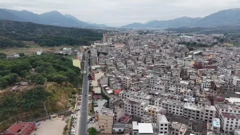 Aerial Drone View Flying Forward Along a Road Between Green Hills and Dense Stock Footage 330159168