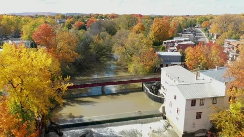 Aerial drone view, flying high above the river in the middle of St-Eustache.. Video stock 256078586