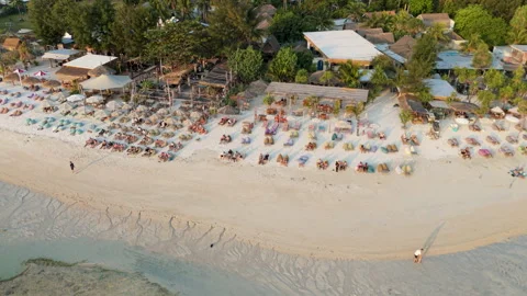 Aerial Drone View Flying Left Along Beach-side Restaurants and Shoreline Stock Footage 346799417