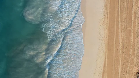Aerial drone view flying over azure waves and sand beach, no people Stock Footage 129755502