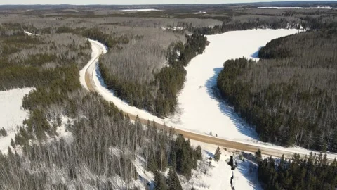 Aerial drone view flying over a winter landscape of small frozen lakes Stock Footage 313544009