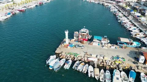 Aerial Drone View Flying Over New Foca Lighthouse, Pier, and Harbor, Turkey Stock Footage 323186460