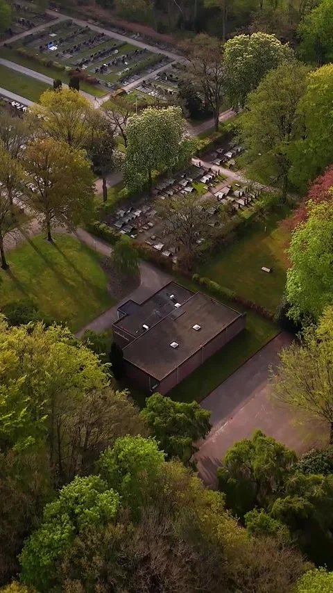 Aerial Drone View Flying Over Peaceful Dutch Cemetery Stock Footage 335476122