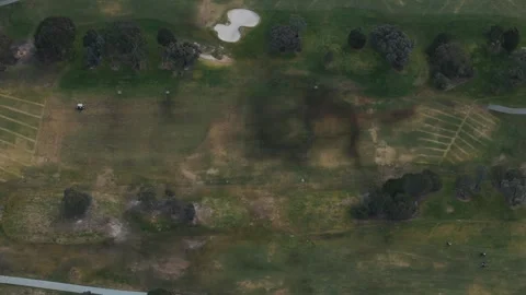Aerial drone view flying over a lush green golf course Video stock 342572669