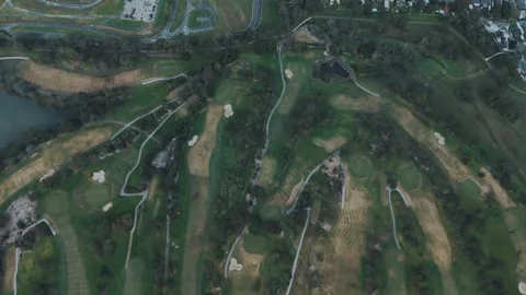 Aerial drone view flying over a vast green golf course 스톡 동영상 342579656