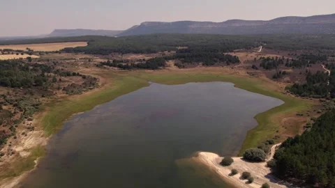 Aerial drone view flying over La Cuerda del Pozo reservoir in Soria Видео 342605742