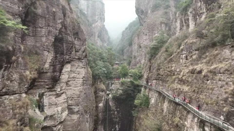Aerial drone view flying through majestic canyon in Zhejiang, showcasing Stock Footage 336652115
