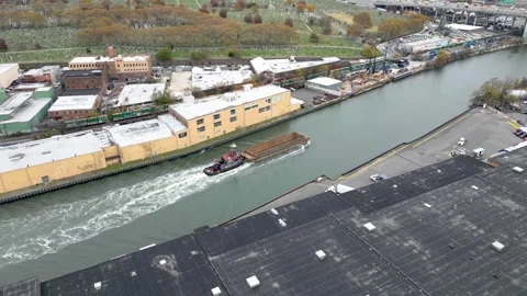 Aerial drone view flying toward NYC skyline with East River stretching below Stock Footage 321671450