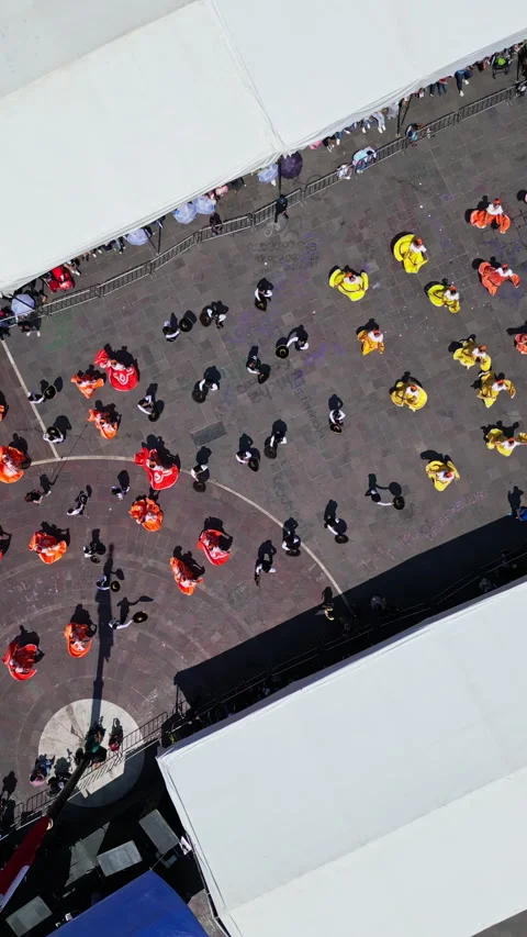 Aerial drone view of folk dancers and fair tents seen from above during the San 스톡 동영상 342062453