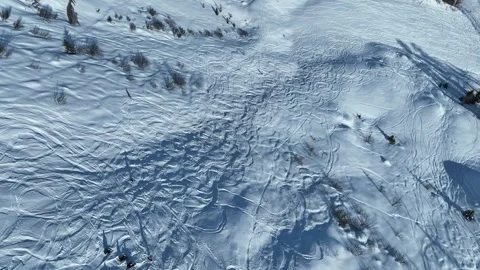 Aerial drone view of freeride ski and snowboard in winter. Riding in powder.. Stock Footage 303890005