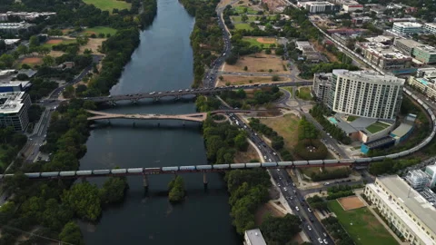 Aerial Drone View of Freight Train Crossing MoPac Colorado River Railroad Bridge Video stock 328160722